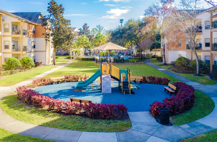 Tiny park playground with play structure and seating, completed playground by Pro Playgrounds