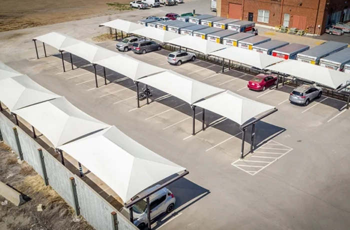 Shade structure installation with multiple fabric parking shades.