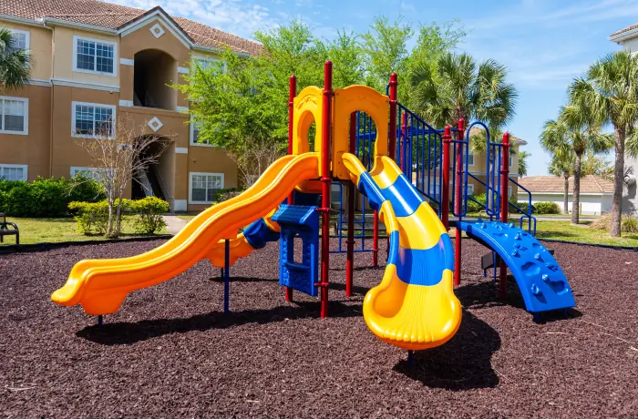 Completed apartment playground installation in a residential courtyard.