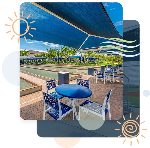 Blue fabric shade canopy over outdoor dining tables in commercial plaza courtyard