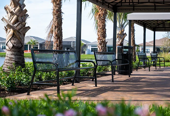 Modern metal benches under covered walkway, installed by Pro Playgrounds