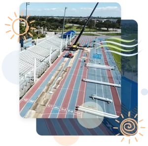 Shade structure installation in progress by Pro Playgrounds over bleachers at field stadium
