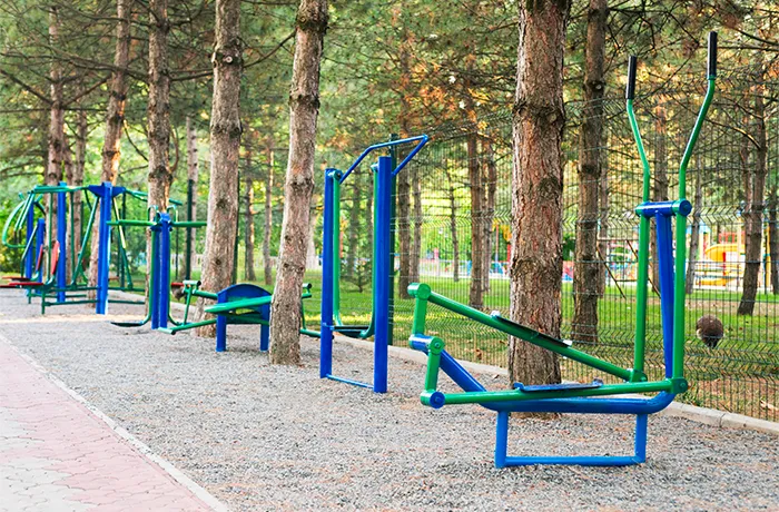 Multiple outdoor fitness stations installed in a park