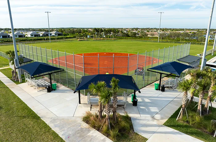 Completed shade structure installation by Pro Playgrounds with dugout shade canopies at baseball field