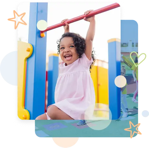 Child hanging from playground monkey bars at daycare playground